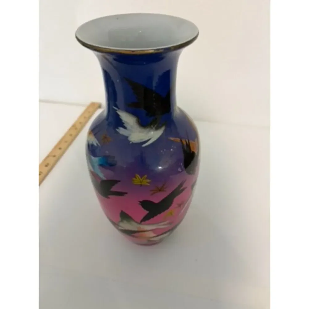 japanese vase with dark blue and pink ground, featuring birds